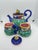 Majolica style teapot with creamer and sugar bowl. Rich colors will really make a statement in your home. Embossed leaf...