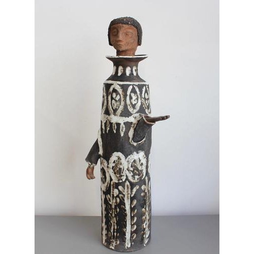 A striking, large-scale (height 75 cm) stoneware figural sculpture by albert thiry (1967), formed as a tall, cylindrical...