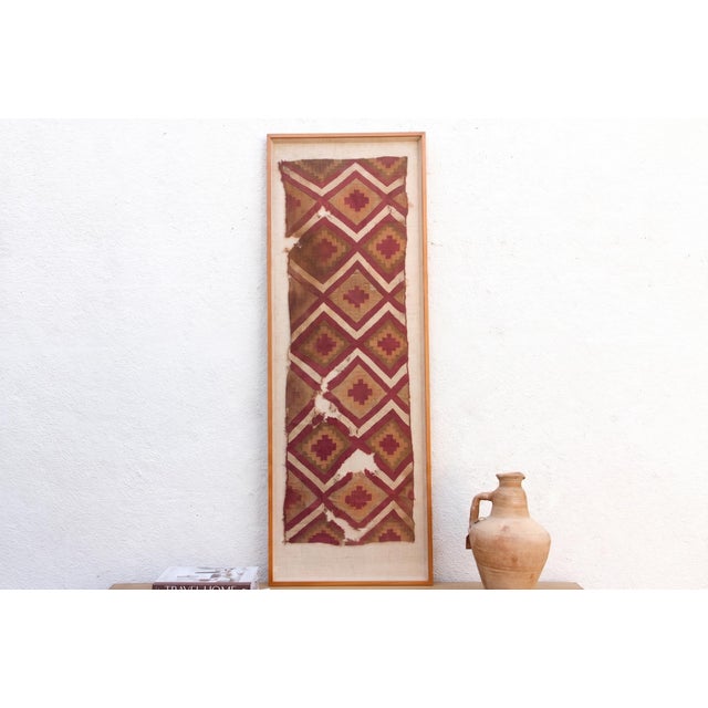This spectacular framed textile panel is an authentic piece of ancient history, originating from the coastal desert...