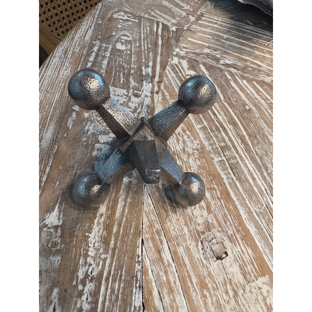 This tabletop sculpture is a classic jack game piece. Distressed metallic finish. Add artistic style with this fun,...