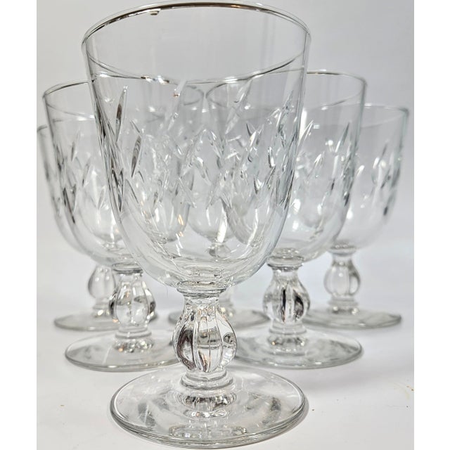 Sheets of glittering rain fall prettily around these cut glass goblets. The deeply cut design shines like starlight in...