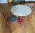 Marble table with cast iron base and two metal chairs with leopard seats. The table is 30" across and 27" high; the chairs...