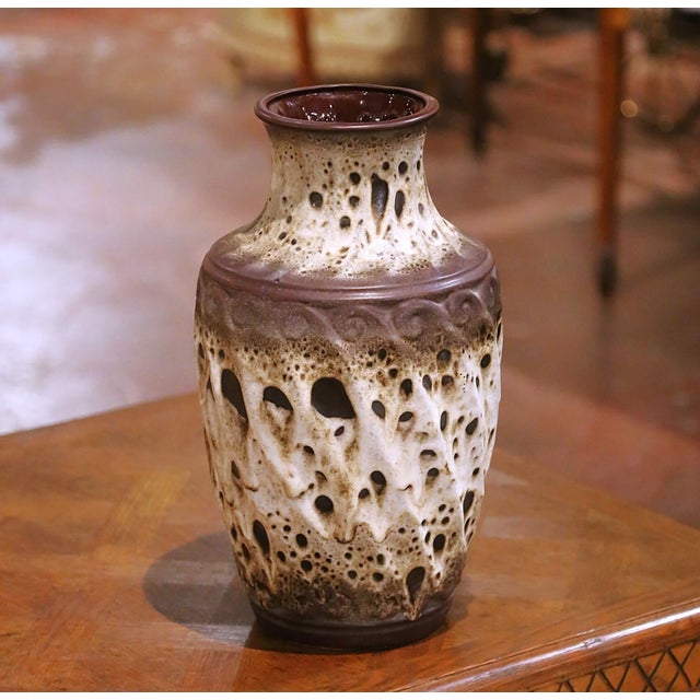 Circa 1970, this striking antique stoneware vase was crafted in West Germany by the renowned ceramics factory Scheurich...