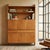 Oak veneered wood cabinet with a drop-leaf desk, exposed drawers, hinged doors, and open compartments. Requires wall...