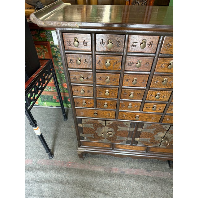 **Antique Korean Apothecary Chest Circa 1920** Unique and beautifully preserved, this antique Korean apothecary chest from...