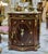 Elevate your interior with this elegant Louis XVI-style commode cabinet, featuring a luxurious marble top, intricate...