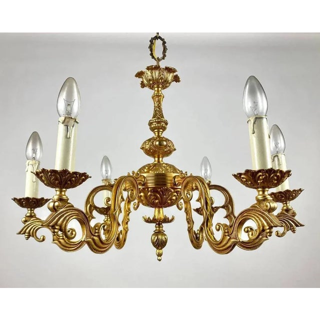 Vintage gilt brass chandelier. french 1960s lighting. the material of manufacture of this unique chandelier is gilded...