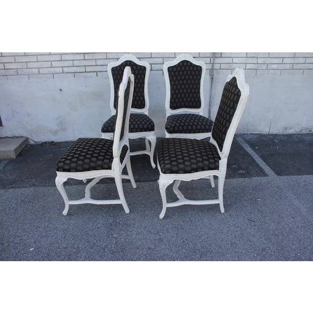 Nice set of four French Louis XVI style side, dining room chairs, each one featuring a carved hand painted frame with a...