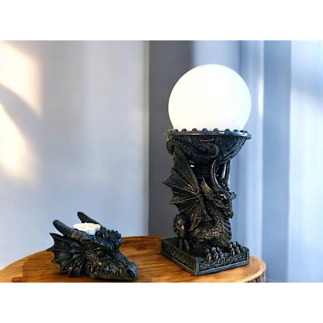 Dragon Table Lamp and Candle Holder A set comprising of a table lamp and a tealight holder. Made of a resin and quite...
