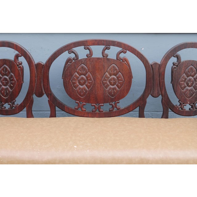 Traditional style carved wood bench/ sofa. Reupholstery recommended. Solid heavy mahogany.