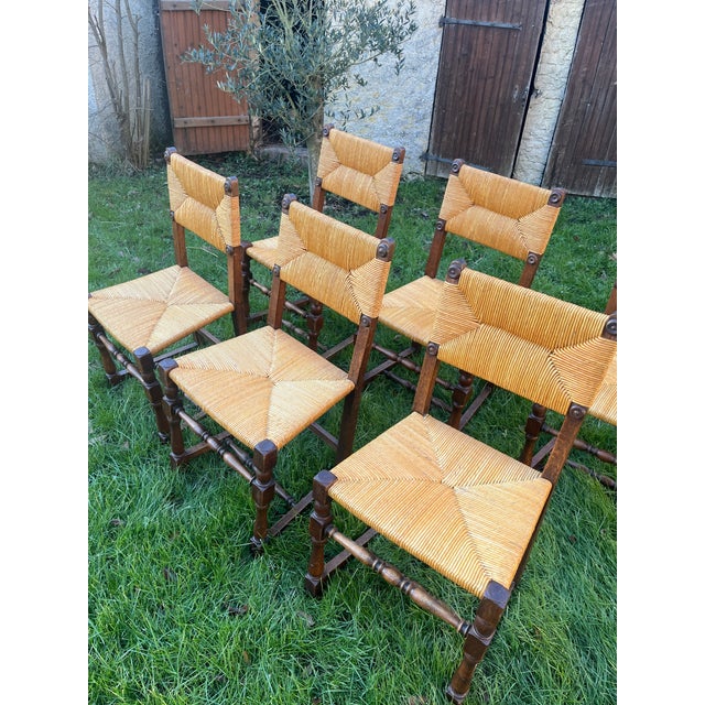 Set of six very original straw and wood chairs reminiscent of the work of Charles Dudouyt (1885-1946). In May 1922,...