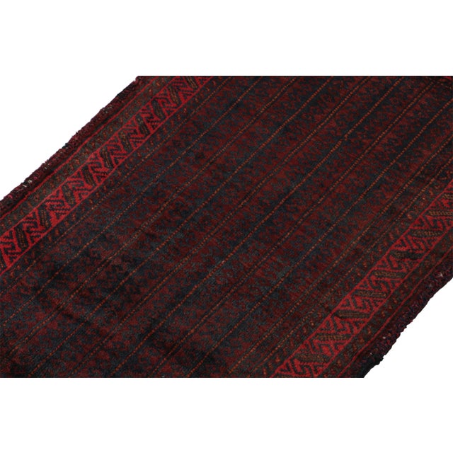 Hand knotted in wool, this 2x3 Baluch scatter rug represents a new line of tribal carpets in the Modern Classics...