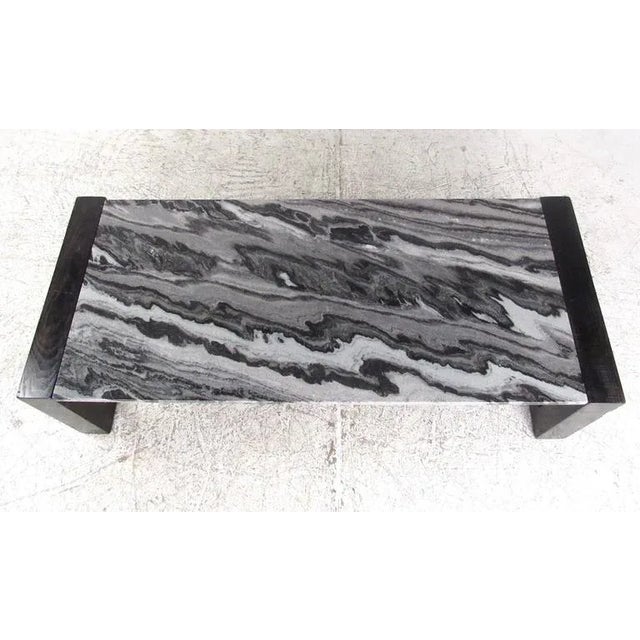 This sturdy marble-top coffee table features square sled leg base and stylish marble-top. Well constructed oak frame has...