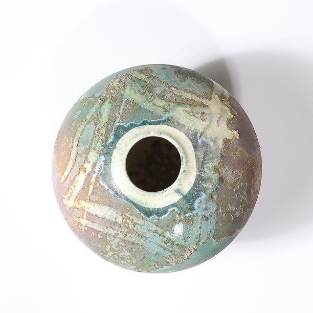 This stunning Mid-Century Modernist ceramic studio art vase by celebrated artist Tony Evans, crafted circa 1980, is a...