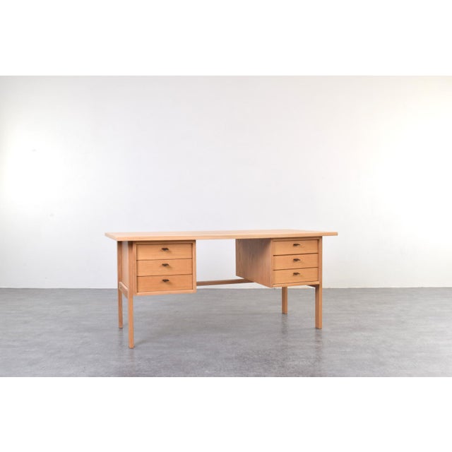 This oak desk was designed in the 1960s by Danish designer Svend Åge Madsen and manufactured by the Sigurd Hansen...