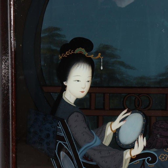 Presenting an antique Chinese wall panel with a portrait of a woman reverse painted on glass and seated in an ebonized...
