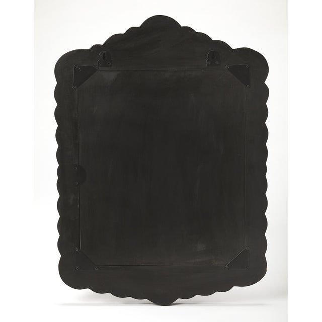 Grace your space with the exquisite beauty of this magnificent Butler Specialty Company wall mirror, a true testament to...