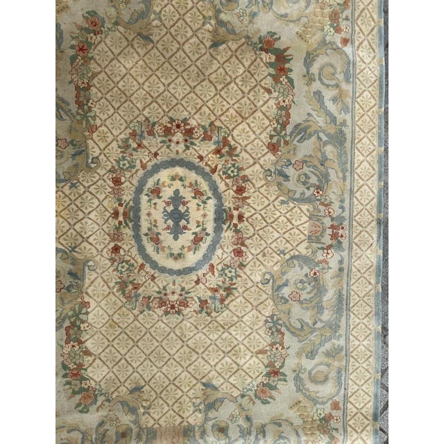 Introducing a stunning Savonnerie rug that boasts a beautiful floral design reminiscent of the Louis XV style. Crafted...