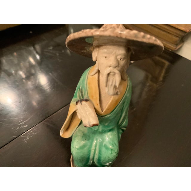 Vintage Chinese ceramic figurine. Don’t you just adore him? He looks to be a wise old man ready to share his knowledge....