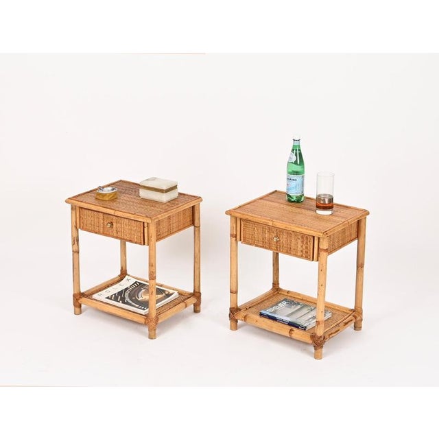 Delightful pair of Mid-Century nightstands in bamboo and woven rattan wicker, completed by solid brass knobs. These lovely...