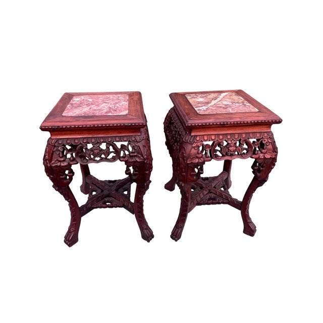 Pair of Carved Marble-Top Chinoiserie Accent Tables An extraordinary pair of carved hardwood accent tables showcasing...