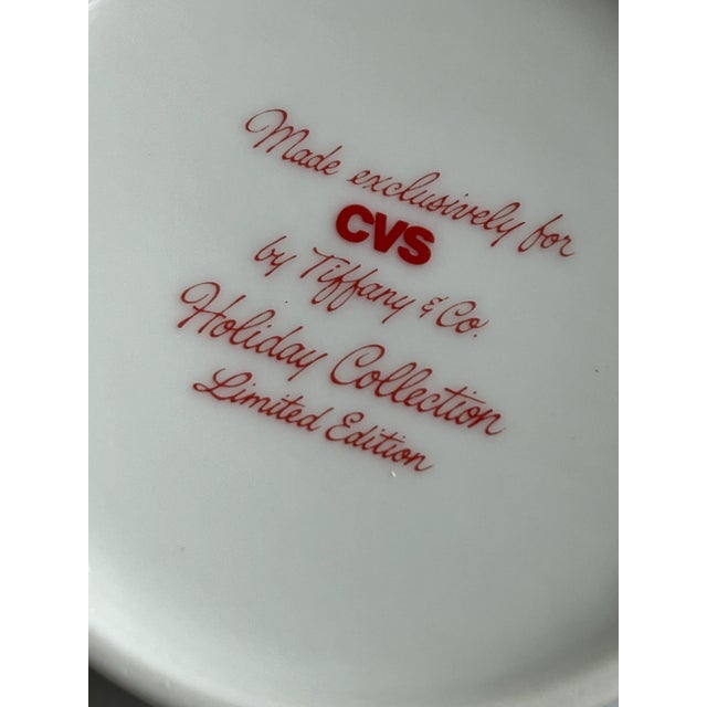 3 Tiffany & Co. whimsical Holiday collection, winter mugs with a red covered bridge, ice skaters and children sledding....