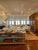 A monumental Belgian linen storage cabinet dating to circa 1890, executed in the classic faux bois tradition — a painted...