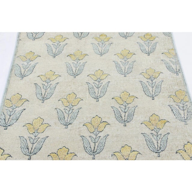 Hand-knotted in a luxurious blend of wool and silk, this 4x5 rug is a radiant and sophisticated addition to the Rug &...