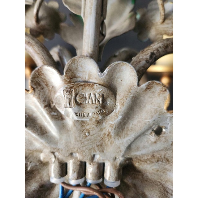 A set of three colorful, exceptionally large, and very rare hand-painted, hand-forged ciani firenze wall sconces,...