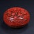 This beautifully carved round lidded box features classic Chinese cinnabar red lacquer detailing. The top surface is...
