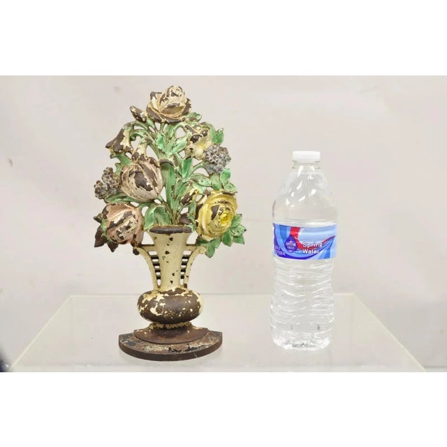 Antique Victorian Hubley Tall Cast Iron Figural Floral Painted Bouquet Door Stop. Circa Early 1900s. Measurements: 10.5" H...