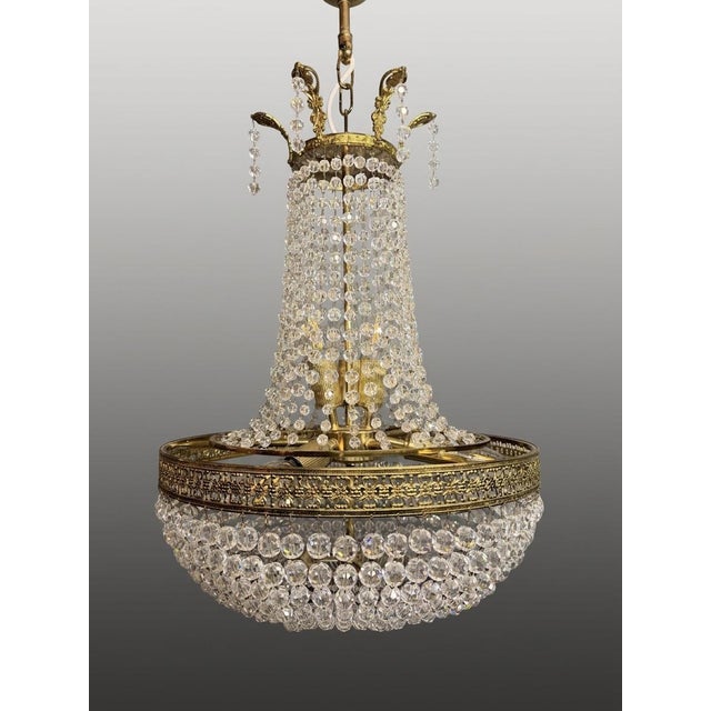 Exquisite French Sac de Pearl chandelier, early 20th century, designed in the Empire style with a finely cast brass basket...