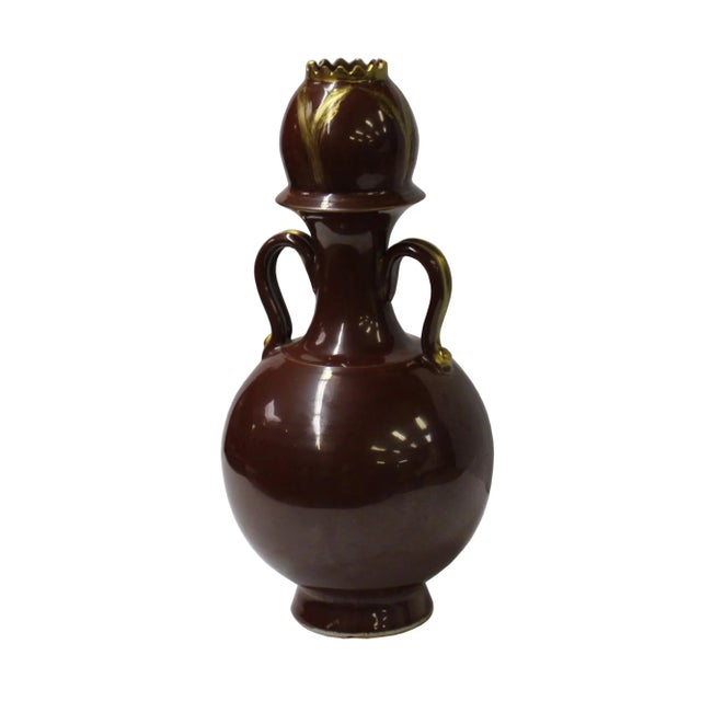 This is a handmade Chinese accent decorative art made of ceramic in blood brown #420900 color. This piece has a golden...