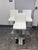 Design Plus Gallery presents Set of Three Contemporary Adjustable Swivel Bar Stools. Each stool is upholstered in white...
