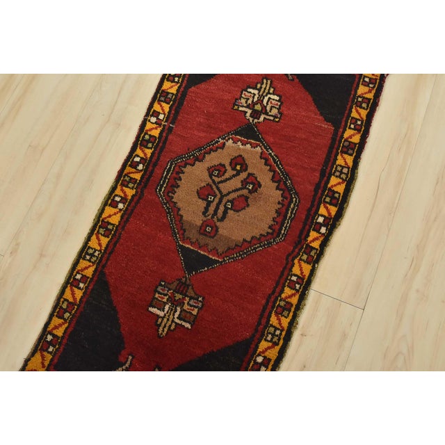 An authentic vintage tribal Malatya rug hand-knotted with fine wool and natural dyes. This nomadic oriental rug features a...