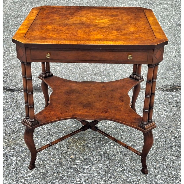 A Regency Style Mahogany and Yew Wood Crossbanded Inlay Single drawer tiered Side Table with faux legs and stretcher....