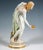 Extremely decorative, fully sculptural representation of an art nouveau beauty in a softly falling robe, tilted forward to...