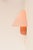 A great and rather large vintage pale pastel pink ikea 80s sconce or wall lighting, which has a round metal fixture with a...