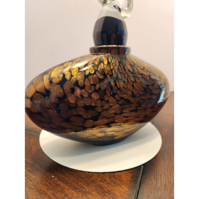 This is an impressive, heavy-gauge art glass scent bottle/decorative vessel featuring a striking oval body encased with...
