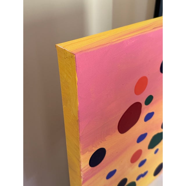 An abstract colorful painting done with acrylic on canvas. Signed AK.