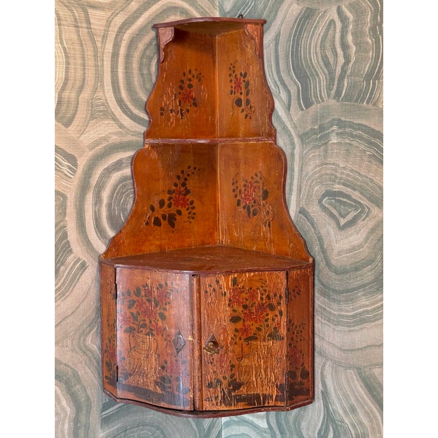 19th century English painted hanging corner cupboard with two open shelves above a pair of doors. The back boards have...