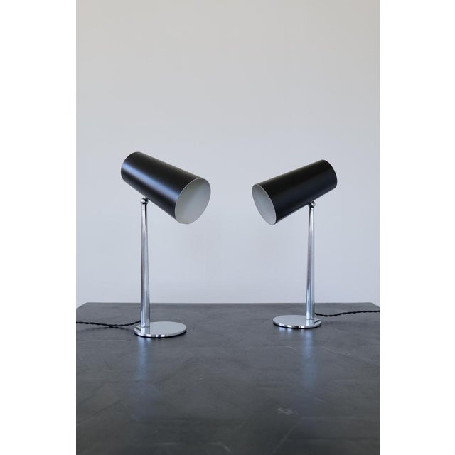 A wonderful pair of midcentury table lamps designed and produced in Denmark by Svend Aage Holm Sörensen. The black...