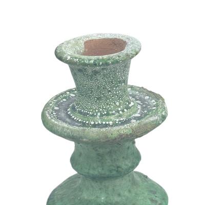 A Moroccan Tamegroute glazed candlestick holder is a handcrafted piece made in the historic pottery village of Tamegroute...