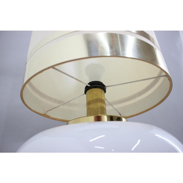 Base part made of glass and brass. Fabric and brass lamp shade. 3 modes of light. Fabric lamp shade with minor signs of...