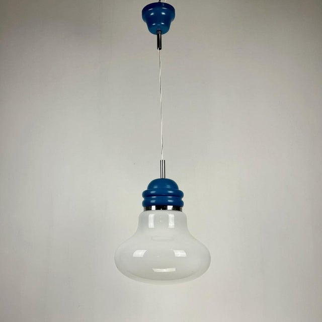 Mid-Century Modern Italian Blue D Bulb Pendant Light, 1970s, in Very Good conditions. Designed 1970 to 1979 Up to 250V...