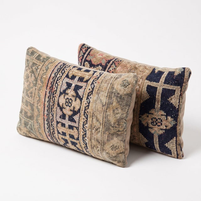 This 16'' x 24'' pillow cover set was made from authentic Turkish rug pieces — navy geometric medallions on soft beige...