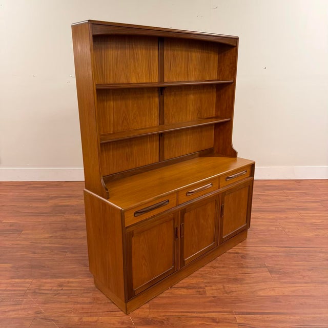 Vintage two-piece teak plinth base sideboard with hutch, made in the U.K. by G-Plan circa early 1970's. The bottom buffet...