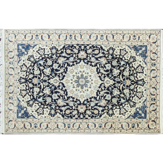 Wool and silk Persian rug. Nain rugs are constructed using the Persian knot and typically have between 300 and 700 knots...