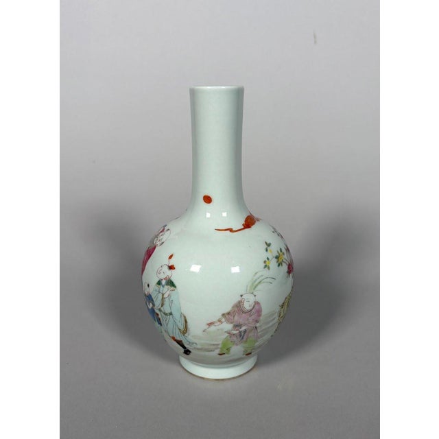 A famille rose porcelain vase from the Yongzheng period (1677-1736), 18th century. The famille rose decoration depicts two...