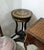Add a sophisticated European accent to your interior with this French Louis XVI-inspired pedestal side table, featuring a...